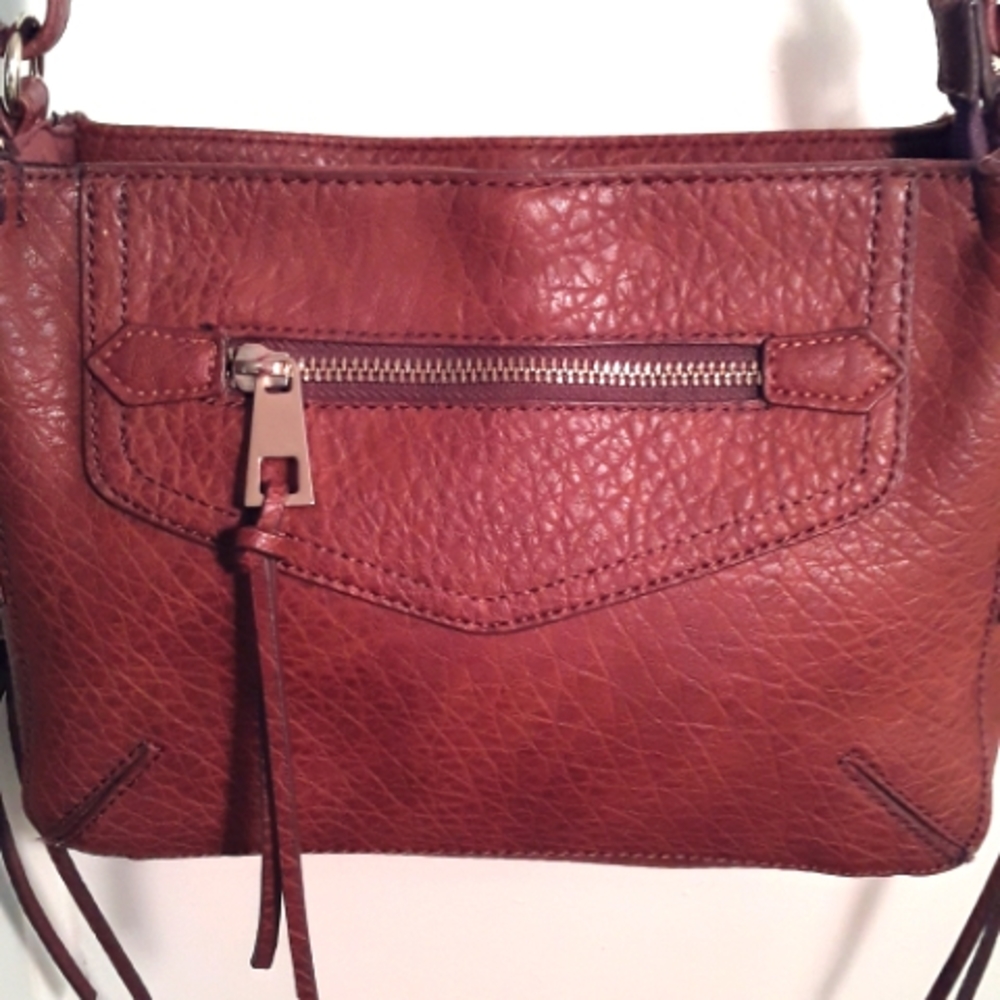 A+ dark tan adjustable crossbody bag.